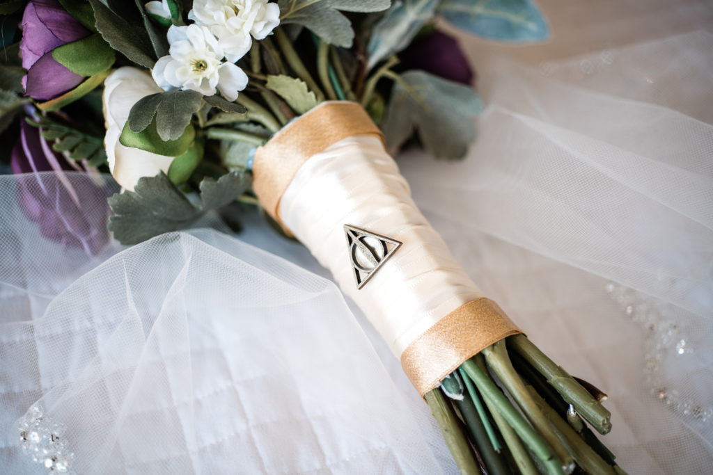 Deathly Hallows pin on wedding bouquet